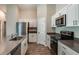 Well-equipped kitchen featuring stainless steel appliances, including a refrigerator, stove, and microwave at 762 Ambleside Dr, Haines City, FL 33844