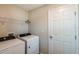 Laundry room featuring a washer and dryer with wire shelving at 762 Ambleside Dr, Haines City, FL 33844