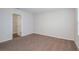 Bedroom featuring neutral walls, carpeted floor, and an open doorway leading to a closet at 3730 King Hill Dr, Haines City, FL 33844