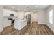Bright kitchen featuring white cabinets, stainless steel appliances, and an island at 3730 King Hill Dr, Haines City, FL 33844