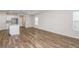 Spacious room with hardwood floors, kitchen, and plenty of natural light at 3730 King Hill Dr, Haines City, FL 33844