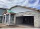New home under construction showcases concrete walls and framing for the garage and covered porch at 5728 Haystack Drive, St Cloud, FL 34771
