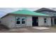 New single-story home construction with a green roof and block construction at 5728 Haystack Drive, St Cloud, FL 34771