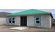 New single-story home construction with a green roof and block construction at 5728 Haystack Drive, St Cloud, FL 34771