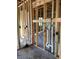 View of the interior under construction, highlighting the stud framing and exposed plumbing work in progress at 5728 Haystack Drive, St Cloud, FL 34771
