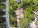 Aerial view of the home, its landscaped yard, driveway, and surrounding neighborhood at 6642 Parson Brown Dr, Orlando, FL 32819