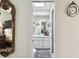 View from bedroom to bathroom featuring a skylight and framed mirror at 6642 Parson Brown Dr, Orlando, FL 32819