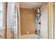 Bathtub with shower and tiled walls with shower curtain at 6642 Parson Brown Dr, Orlando, FL 32819