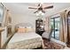 Cozy bedroom featuring a ceiling fan and sliding glass doors to the outdoor space at 6642 Parson Brown Dr, Orlando, FL 32819