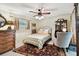 This bedroom features a ceiling fan, antique furniture and decorative rug at 6642 Parson Brown Dr, Orlando, FL 32819