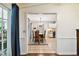Dining area with wooden table, tile flooring, and access to the kitchen at 6642 Parson Brown Dr, Orlando, FL 32819