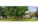 Charming single-story home with a well-maintained lawn and mature trees offering shade at 6642 Parson Brown Dr, Orlando, FL 32819