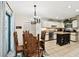 Well-lit dining area with a wooden table and kitchen access at 6642 Parson Brown Dr, Orlando, FL 32819