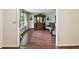 Bright living room featuring hardwood floors, a large window, and elegant furniture arrangement at 6642 Parson Brown Dr, Orlando, FL 32819