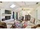 Cozy living room with a brick fireplace, skylight, comfortable seating, and stylish decor at 6642 Parson Brown Dr, Orlando, FL 32819