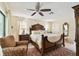Serene main bedroom featuring a decorative ceiling fan, accent rug, and natural light at 6642 Parson Brown Dr, Orlando, FL 32819