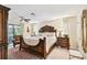 A spacious main bedroom with a decorative rug, neutral color scheme, and lots of light at 6642 Parson Brown Dr, Orlando, FL 32819