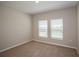 Bedroom featuring two windows and carpeted floor at 1229 Tidal St, Haines City, FL 33844