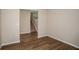 Open entryway featuring wood floors, with view of the stairs leading upstairs at 1229 Tidal St, Haines City, FL 33844