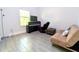 Spare bedroom with neutral walls, tiled floor, and window provides a quiet retreat for guests at 1430 Tern Ct, Poinciana, FL 34759