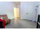 This bedroom features tile floors, neutral walls, and is bathed in natural light at 1430 Tern Ct, Poinciana, FL 34759