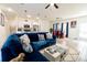 Spacious open-concept living room with a dining area and modern kitchen appliances at 1430 Tern Ct, Poinciana, FL 34759