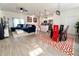 This large open concept living area boasts a modern kitchen with stainless appliances and a dining area at 1430 Tern Ct, Poinciana, FL 34759