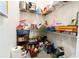 Pantry stocked with various food items and household supplies on wire shelving at 1430 Tern Ct, Poinciana, FL 34759