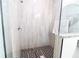 Shower with stylish tile, rainfall shower head, and glass enclosure creates a spa-like experience at 1430 Tern Ct, Poinciana, FL 34759