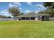 Expansive backyard with lush green lawn, perfect for outdoor activities and Gathering gatherings at 1610 Sherwood Lakes Blvd, Lakeland, FL 33809