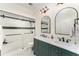Modern bathroom features double sinks, quartz countertop, and walk-in shower with stylish black hardware at 1610 Sherwood Lakes Blvd, Lakeland, FL 33809