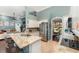 Bright kitchen featuring granite countertops, stainless steel appliances and views into the living room at 1610 Sherwood Lakes Blvd, Lakeland, FL 33809