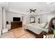 Spacious main bedroom boasts wood-look floors, tray ceiling, and ample natural light at 1610 Sherwood Lakes Blvd, Lakeland, FL 33809