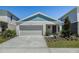 Charming single-Gathering home with a well-manicured front yard and a two-car garage at 4011 Gardenia Ave, Lake Hamilton, FL 33851