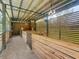 Bright open barn interior with wooden stalls and a metal roof at 5080 Maple Dr, Lakeland, FL 33810
