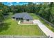 Beautiful single-story home on a large lot featuring a well-manicured lawn and long driveway at 5080 Maple Dr, Lakeland, FL 33810