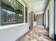 Inviting front porch with decorative tile, a large window, and a calming exterior color palette at 5080 Maple Dr, Lakeland, FL 33810