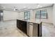 Kitchen island featuring granite counters, and stainless steel dishwasher, with open floor plan at 5080 Maple Dr, Lakeland, FL 33810