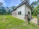 Versatile outbuilding with secure doors and a gated area, ideal for a workshop or secure storage at 5080 Maple Dr, Lakeland, FL 33810