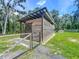 Well-maintained outbuilding with gated enclosure, suited for various outdoor activities and storage needs at 5080 Maple Dr, Lakeland, FL 33810