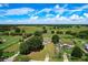 Wide aerial view captures the property's location surrounded by farm fields and countryside at 5268 Rock Dove Loop, Lakeland, FL 33810