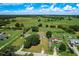 Aerial view showcases the home's location within a serene area surrounded by farmland and greenery at 5268 Rock Dove Loop, Lakeland, FL 33810