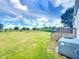 Expansive backyard with lush green grass, trees, and a peaceful, open view at 5268 Rock Dove Loop, Lakeland, FL 33810
