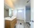 Bathroom with wood-look flooring, vanity and sink, toilet, and a shower stall at 5268 Rock Dove Loop, Lakeland, FL 33810