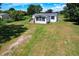 Aerial view of house on a large lot with a well-maintained lawn at 5268 Rock Dove Loop, Lakeland, FL 33810