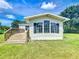 Exterior view of a single-story home showing the front and lawn at 5268 Rock Dove Loop, Lakeland, FL 33810
