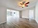 Open living area with laminate flooring, recessed lighting, and views into other rooms at 5268 Rock Dove Loop, Lakeland, FL 33810