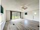 Open living area with modern flooring, bright windows, and a welcoming entryway at 5268 Rock Dove Loop, Lakeland, FL 33810