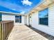 View of the entrance of the home with wooden porch at 5268 Rock Dove Loop, Lakeland, FL 33810