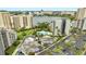 Aerial view of building with green space, pool, parking lot and a lake in the background at 6165 Carrier Dr # 1309, Orlando, FL 32819